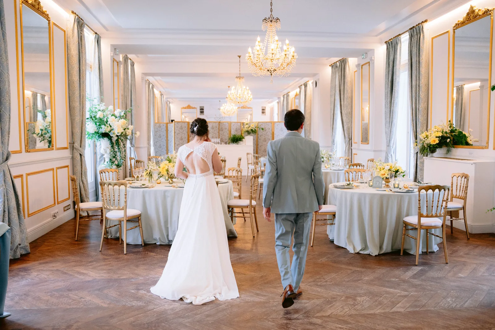 A newlywed couple seeing their reception room together