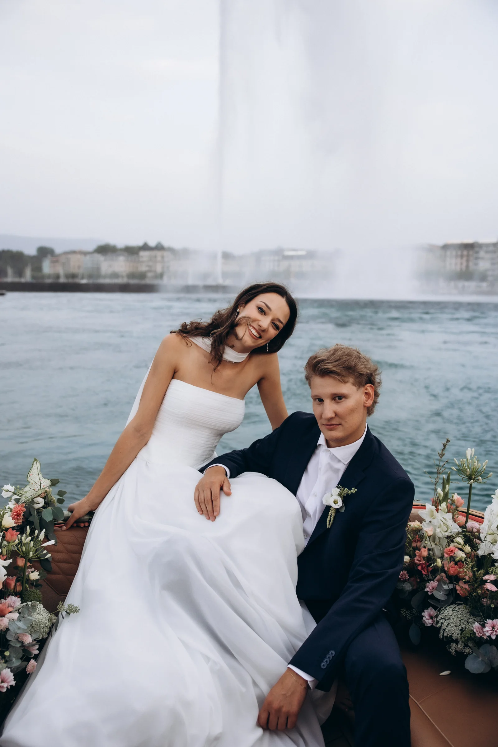 Solenne and Axel on the flower-decorated boat in front of Geneva’s Jet d’Eau