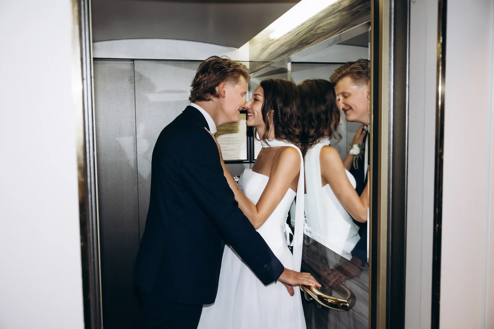 The couple reflected in the mirrors at Hotel Rotary