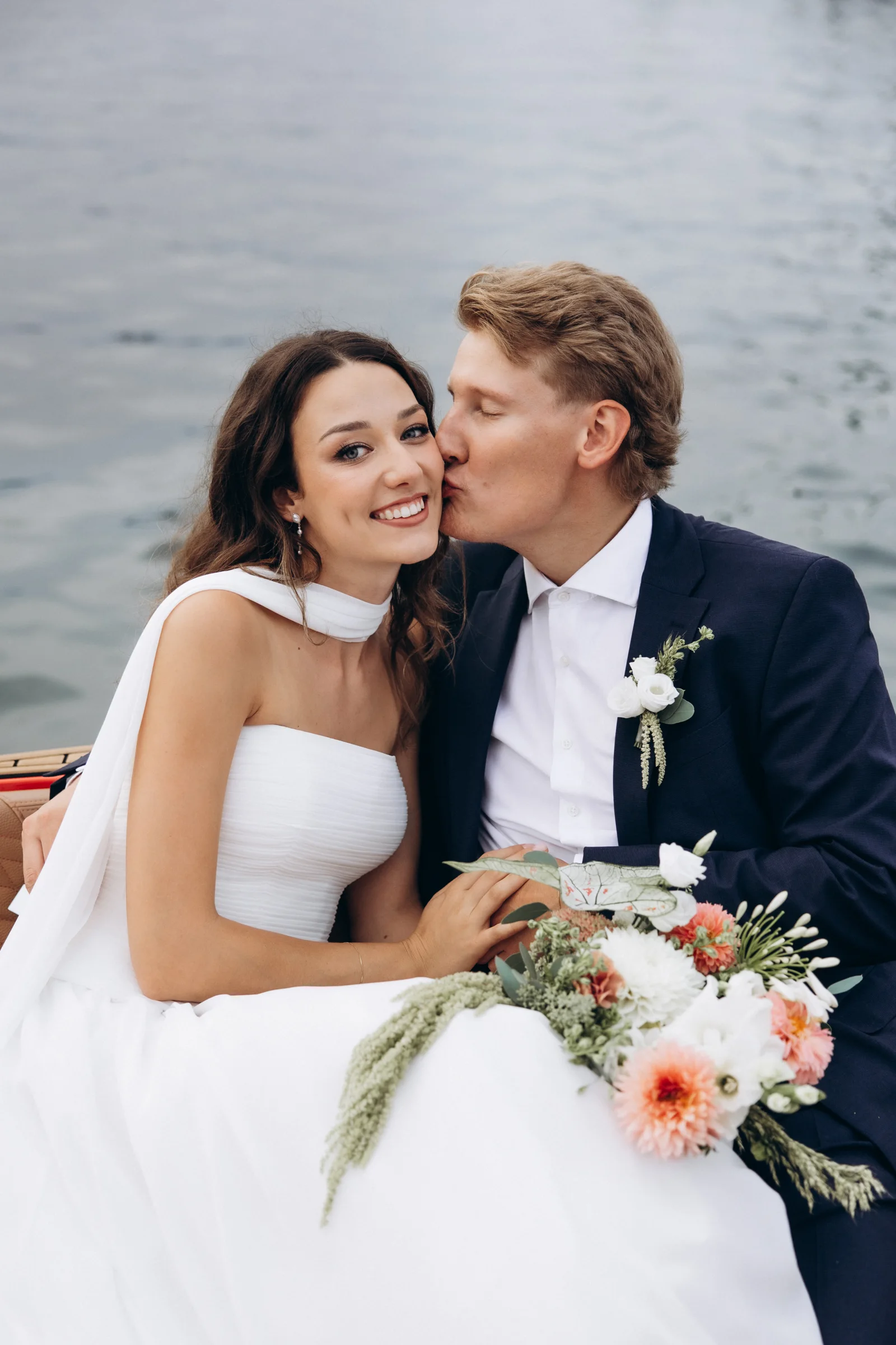Solenne and Axel smiling on the boat