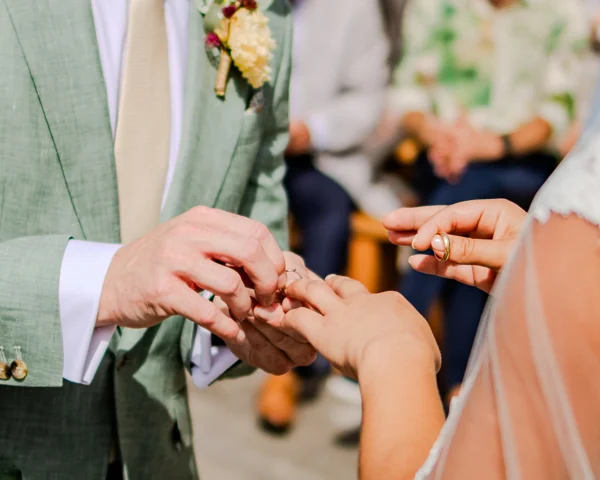 An exchange of wedding rings, photographed by Matthieu Philippart