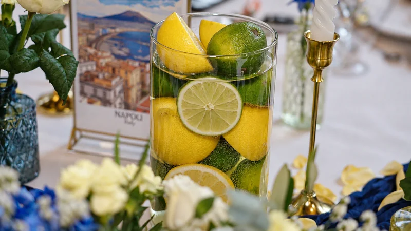 Lemons, blue flowers and candles in the Italian-inspired table decorations