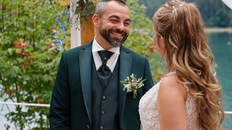 Nicola smiles at Tiphaine during their ceremony beside Lake Montriond