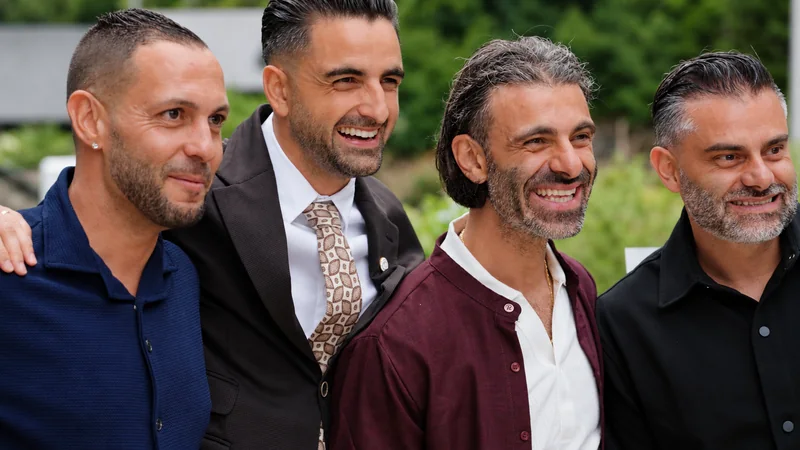 Guests smiling at the drinks reception