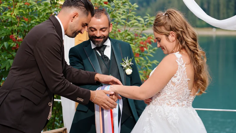 Tiphaine and Nicola taking part in a ritual during their lakeside ceremony