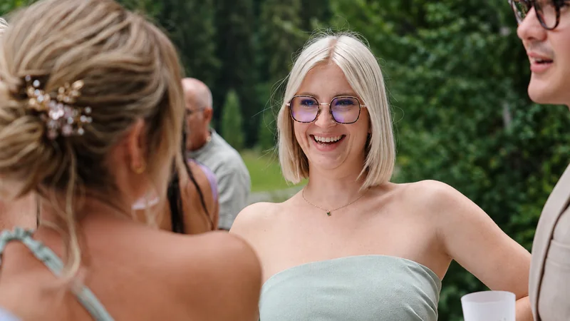Tiphaine’s sister laughing with guests at the drinks reception